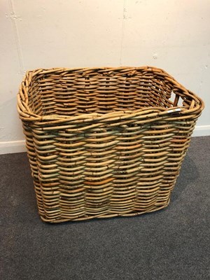 Lot 1094 - A country house wicker log basket, 80cm wide x...