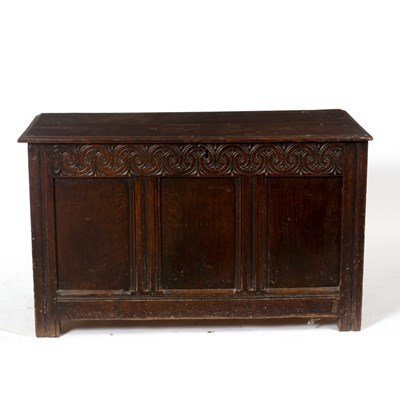 Lot 1099 - A late 18th Century oak chest with carved...