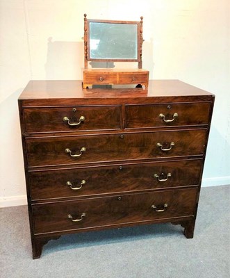 Lot 1106 - A George III mahogany chest of three long and...