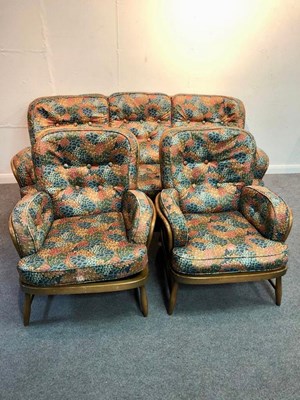 Lot 1116 - An Ercol sofa and two matching chairs, circa...