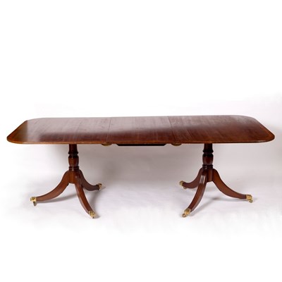 Lot 1127 - A mahogany two-pillar dining table with one...