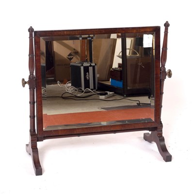 Lot 1129 - A mahogany swing frame dressing mirror on...