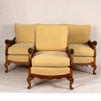 Lot 1133 - A bergère three-seater maple sofa and matching...