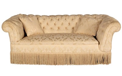 Lot 1145 - A button back Chesterfield sofa upholstered in...