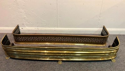 Lot 1149 - A pierced brass fire curb, 133cm wide and...