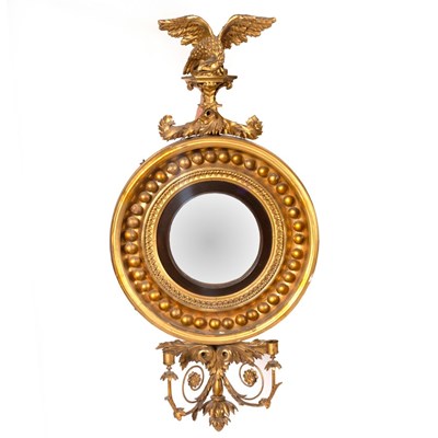 Lot 1153 - A Regency convex mirror, the giltwood ball...