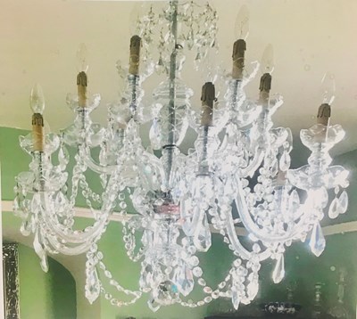 Lot 1173 - A twelve-branch cut glass chandelier with...