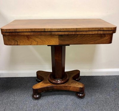 Lot 1189 - A Victorian rosewood fold-over card table on...