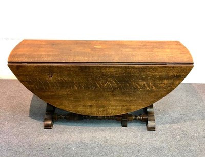 Lot 1202 - A 17th Century style oak gateleg table on a...