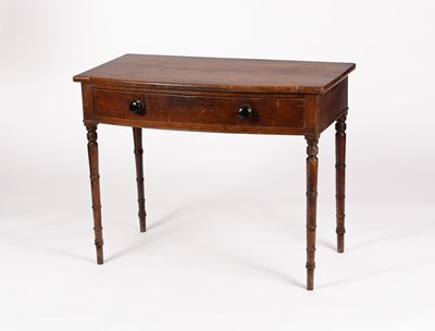 Lot 6 - A George IV bowfront side table fitted a...