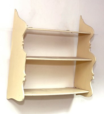 Lot 7 - A set of white painted open shelves with...