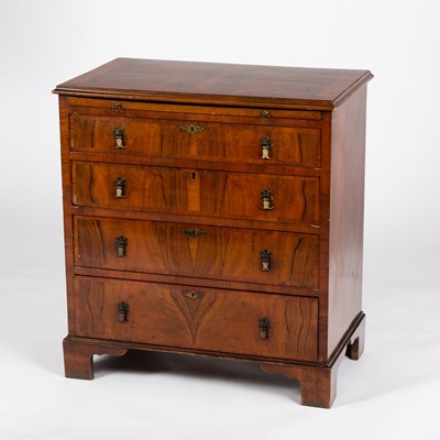 Lot 49 - A walnut chest, circa 1920, of four drawers...