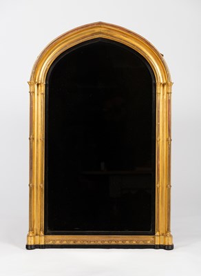 Lot 52 - A Victorian Gothic gilded wall mirror with...