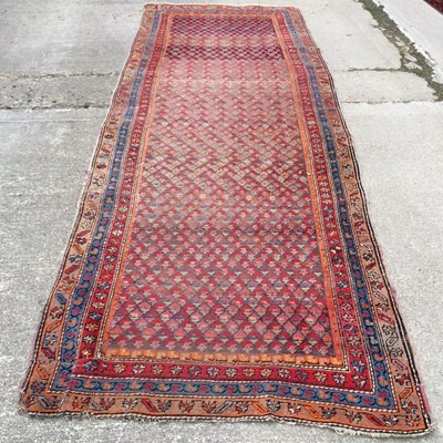 Lot 68 - An Afghan runner with central fields of...