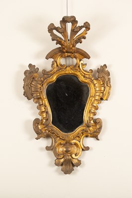 Lot 83 - An Italian giltwood wall mirror of Baroque...