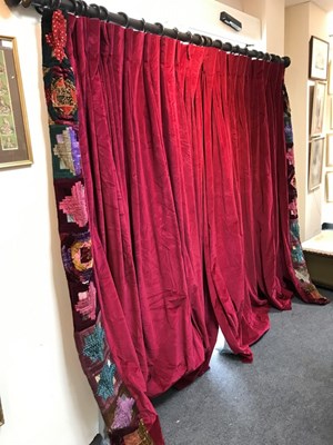 Lot 90 - A pair of crimson velvet curtains with...