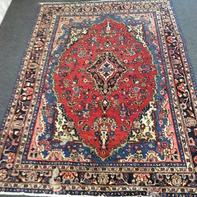 Lot 120 - A Qashqai carpet with central red ground...