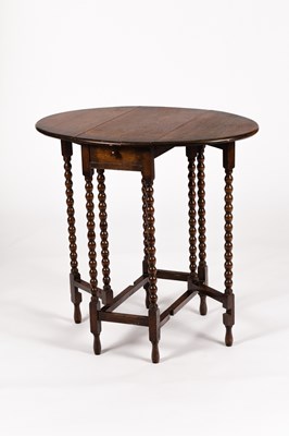 Lot 125 - An oval two-flap gateleg table on slender...