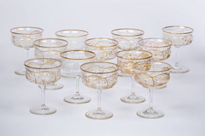 Lot 170 - A set of twelve engraved and gilt champagne...