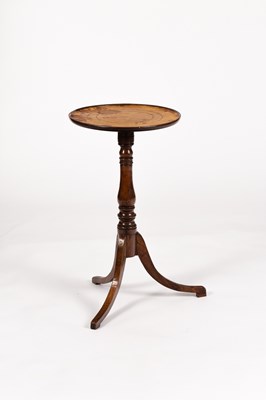 Lot 244 - A small circular table with a leather lined...