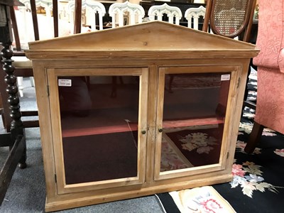 Lot 249 - A hanging pine cupboard enclosed by a pair of...