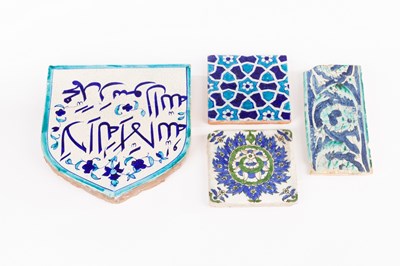 Lot 253 - Four Persian pottery glazed tiles, various