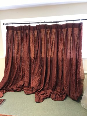 Lot 259 - A pair of dark red silk curtains with pelmet...