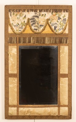 Lot 288 - A wall mirror with a surround of damask panels,...