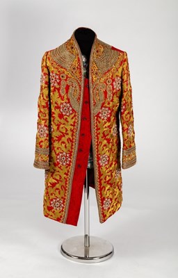 Lot 328 - An Indian coat in claret paisley silk profuse...