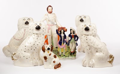 Lot 377 - Two pairs of Staffordshire dogs, a single dog,...