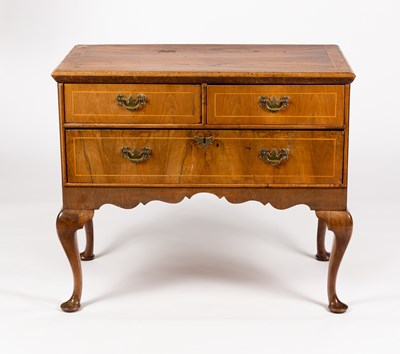 Lot 385 - A walnut chest of one long and two short...