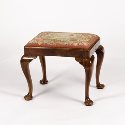 Lot 386 - A walnut dressing stool of Queen Anne design,...