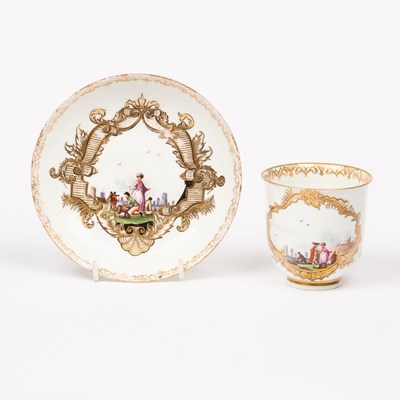 Lot 399 - A Meissen cup and a saucer decorated harbour...