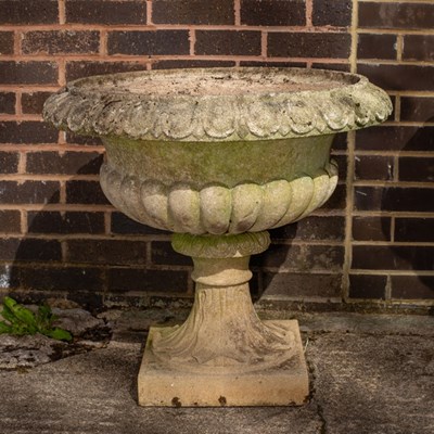 Lot 502 - A large reconstituted stone garden vase with...