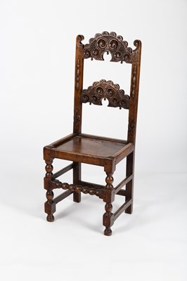 Lot 516 - An oak single chair with pierced and carved...