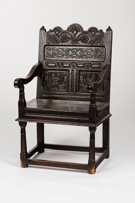 Lot 525 - A carved oak Wainscot chair, the panel back...