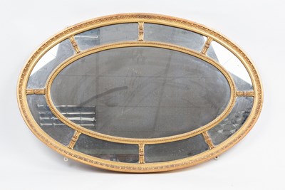 Lot 531 - A George III style oval gilt framed mirror,...