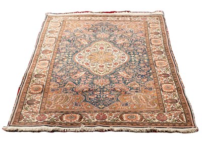 Lot 540 - An Eastern rug with central floral medallion...