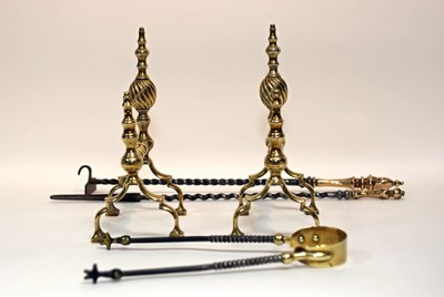 Lot 553 - A pair of brass andirons and a set of steel...