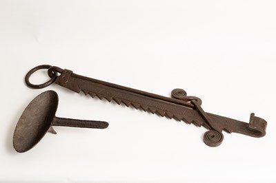 Lot 556 - A wrought iron pot hook with ratchet support,...