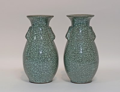 Lot 595 - A pair of Chinese celadon crackle ware vases...