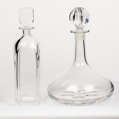 Lot 693 - Two Orrefors glass decanters, one of square...