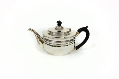 Lot 3 - A silver teapot, London 1911, of oval shape...