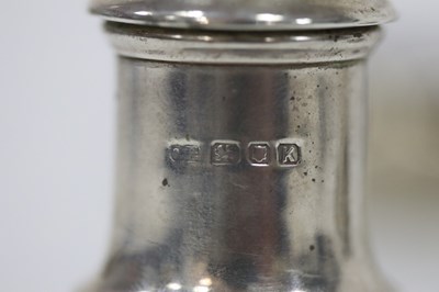 Lot 29 - A matched silver cruet set comprising two...