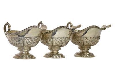 Lot 65 - A set of three silver sauce boats, Elkington &...