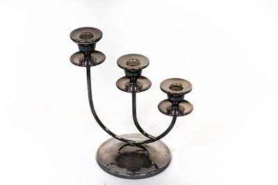 Lot 82 - A modern silver three-branch candlestick,...