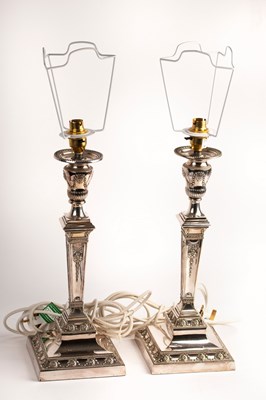 Lot 128 - A pair of silver plated candlesticks, Walker &...