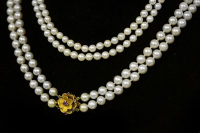 Lot 168 - A cultured pearl two-row necklace, with gem...