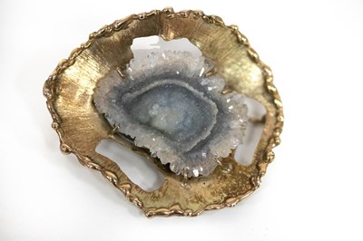 Lot 179 - A geode crystal brooch of modern design, the...