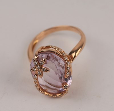 Lot 197 - A kunzite and diamond dress ring set in 18ct...